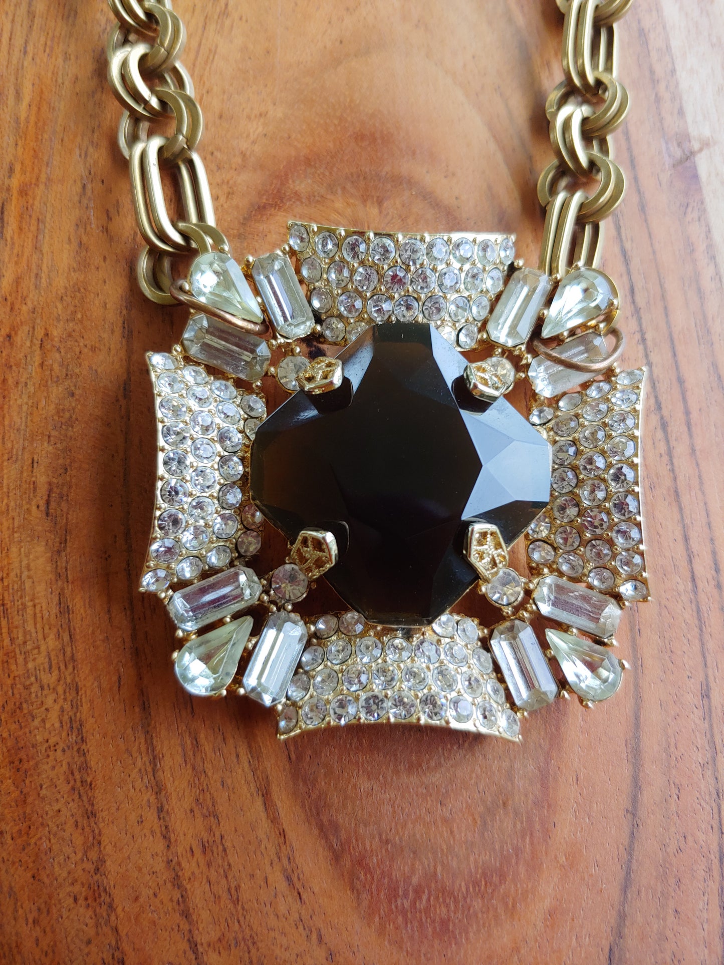 Rhinestone and brown glass pendant on gold necklace