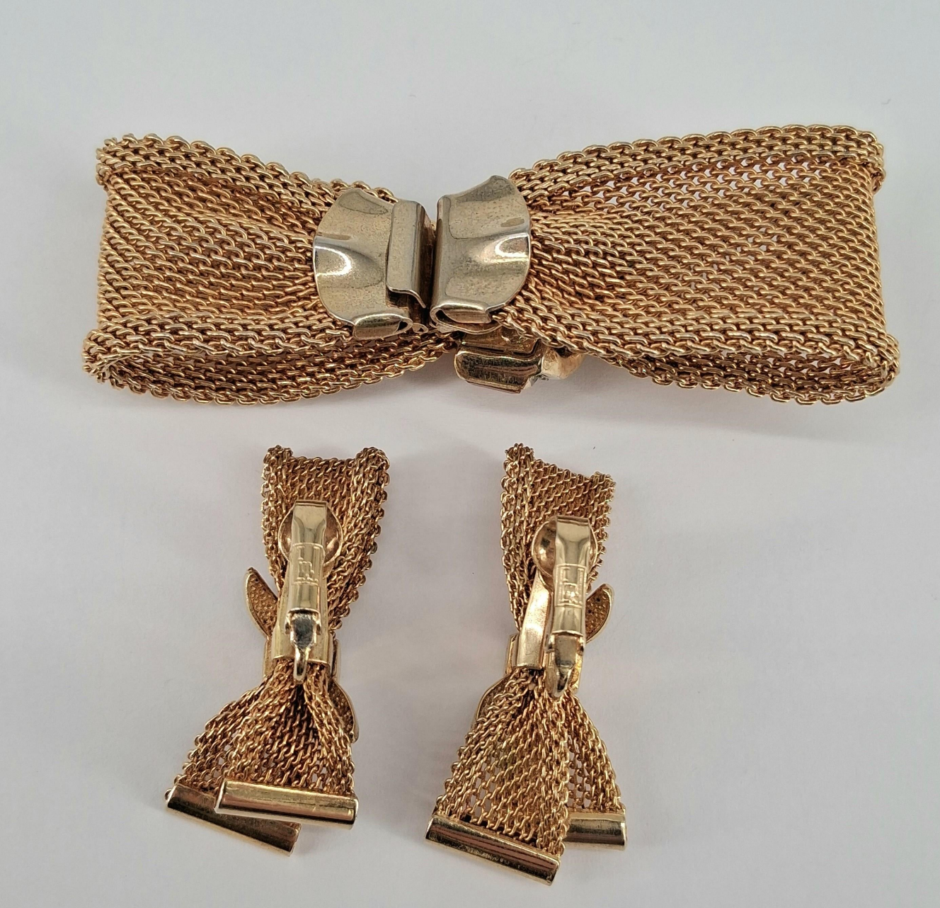 Back of gold bracelet and earrings