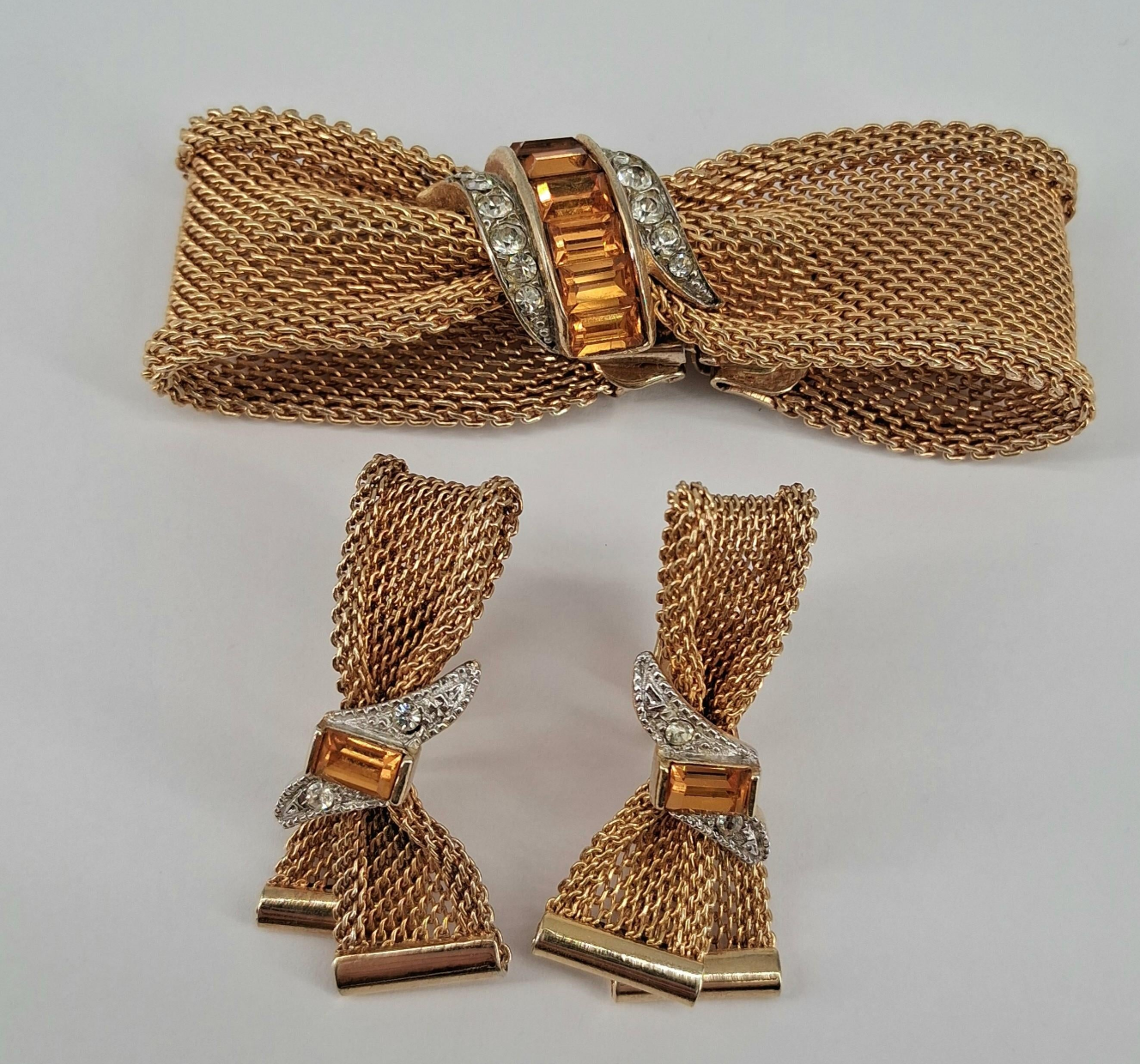 Gold bow bracelet with matching clip-on earrings