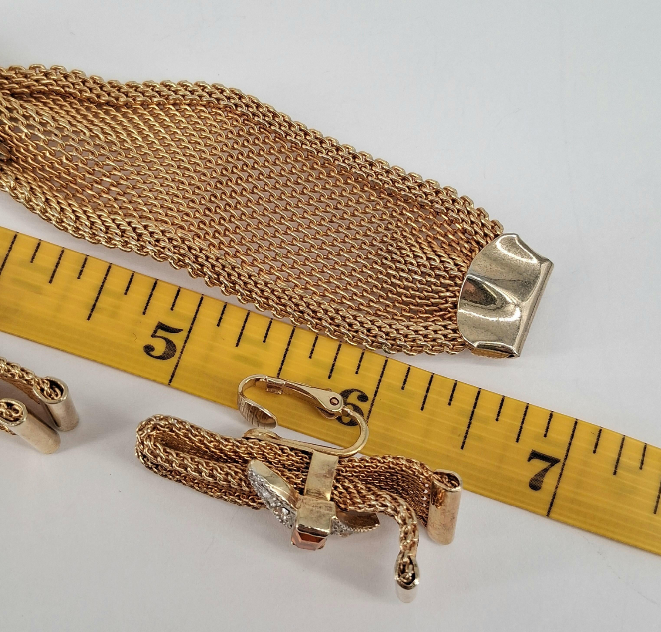 Ruler showing length of bracelet and earring
