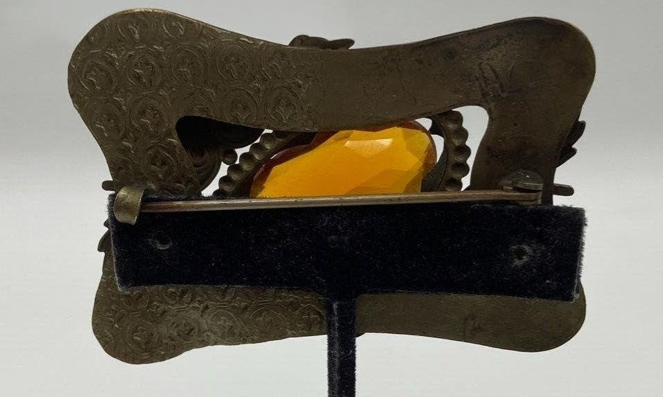 Back of brass and Amber brooch