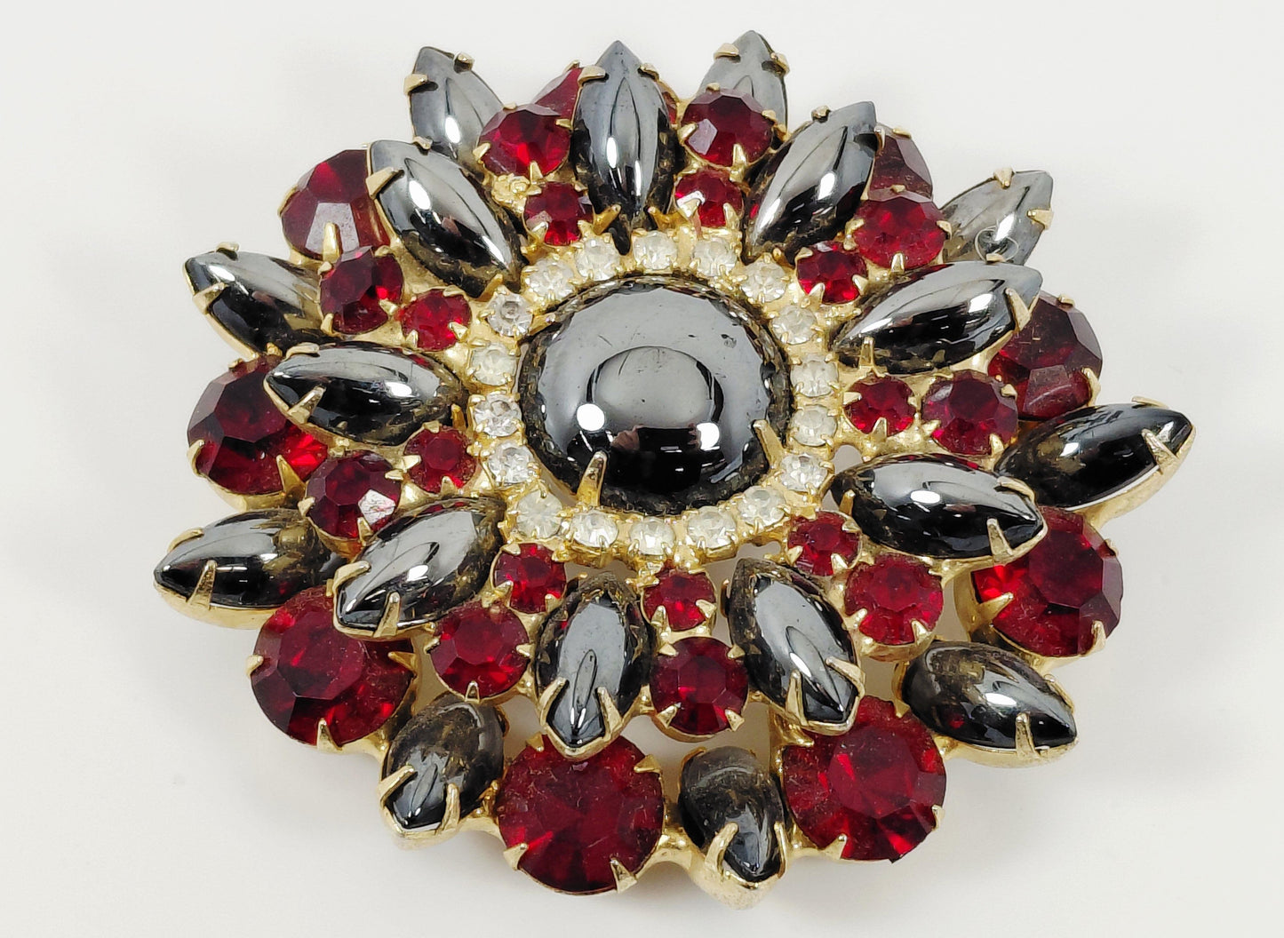 Red and black brooch
