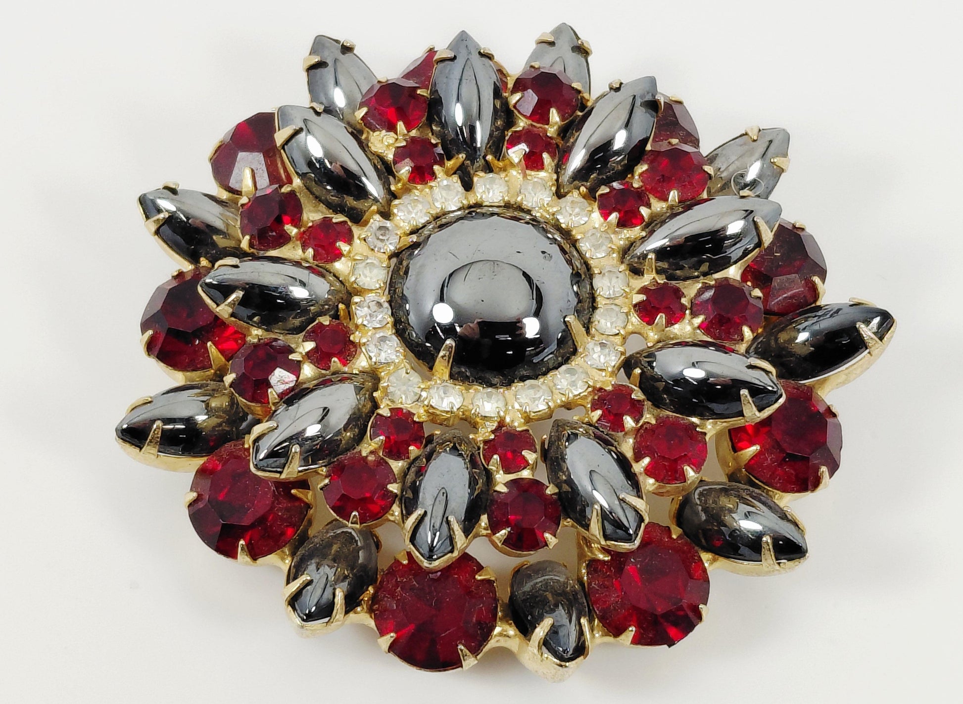 Red and black brooch