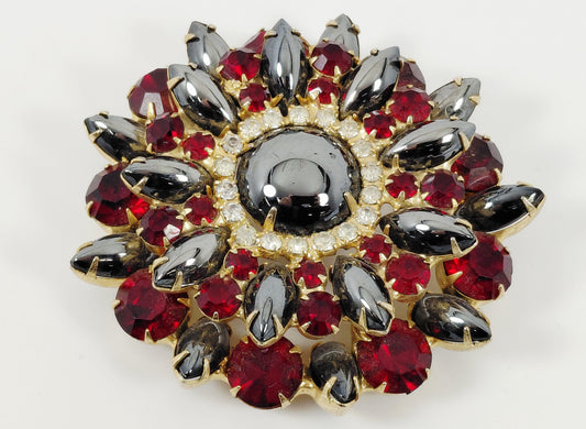 Red and black brooch